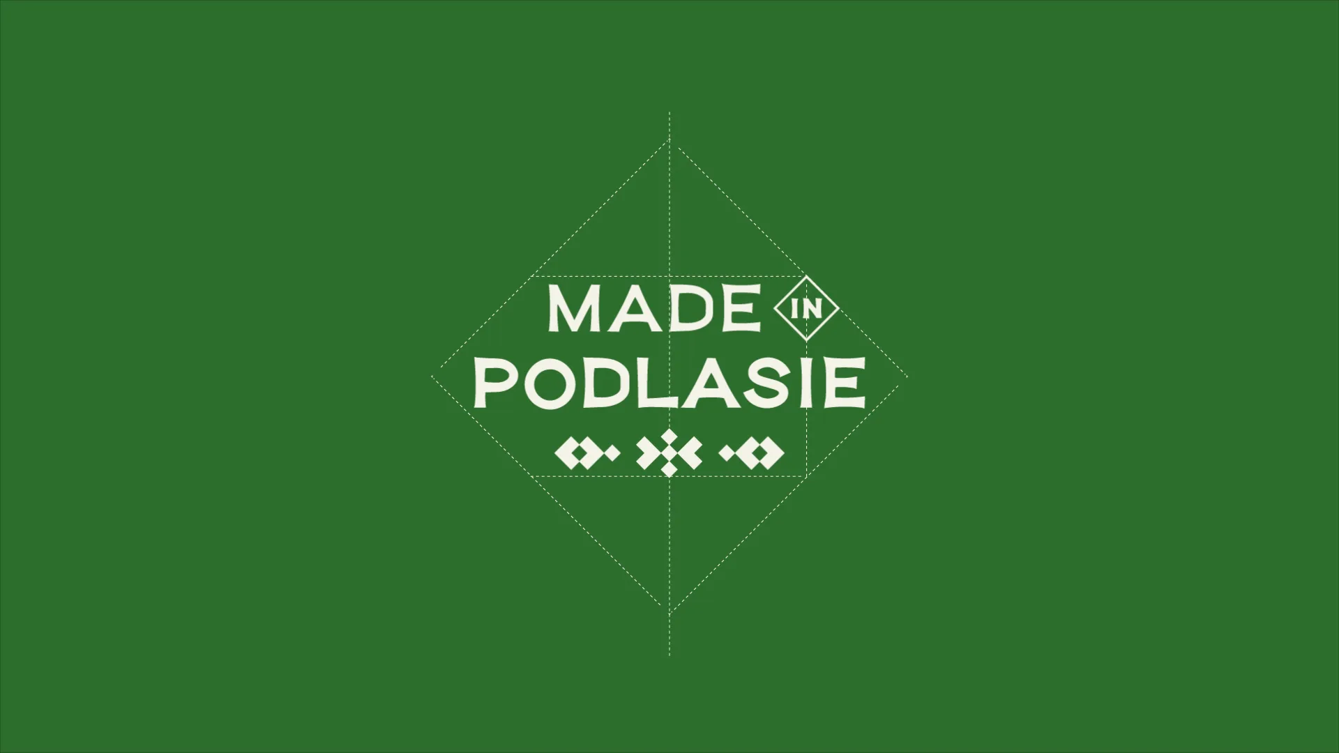 Animacja logo Made in Podlasie: litery, romb z „IN” i ornament wycinanki składają się na zielonym tle i nad łanem zboża.